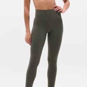 Athleta Salutation Stash Pocket 7/8 tight. Dark Olive